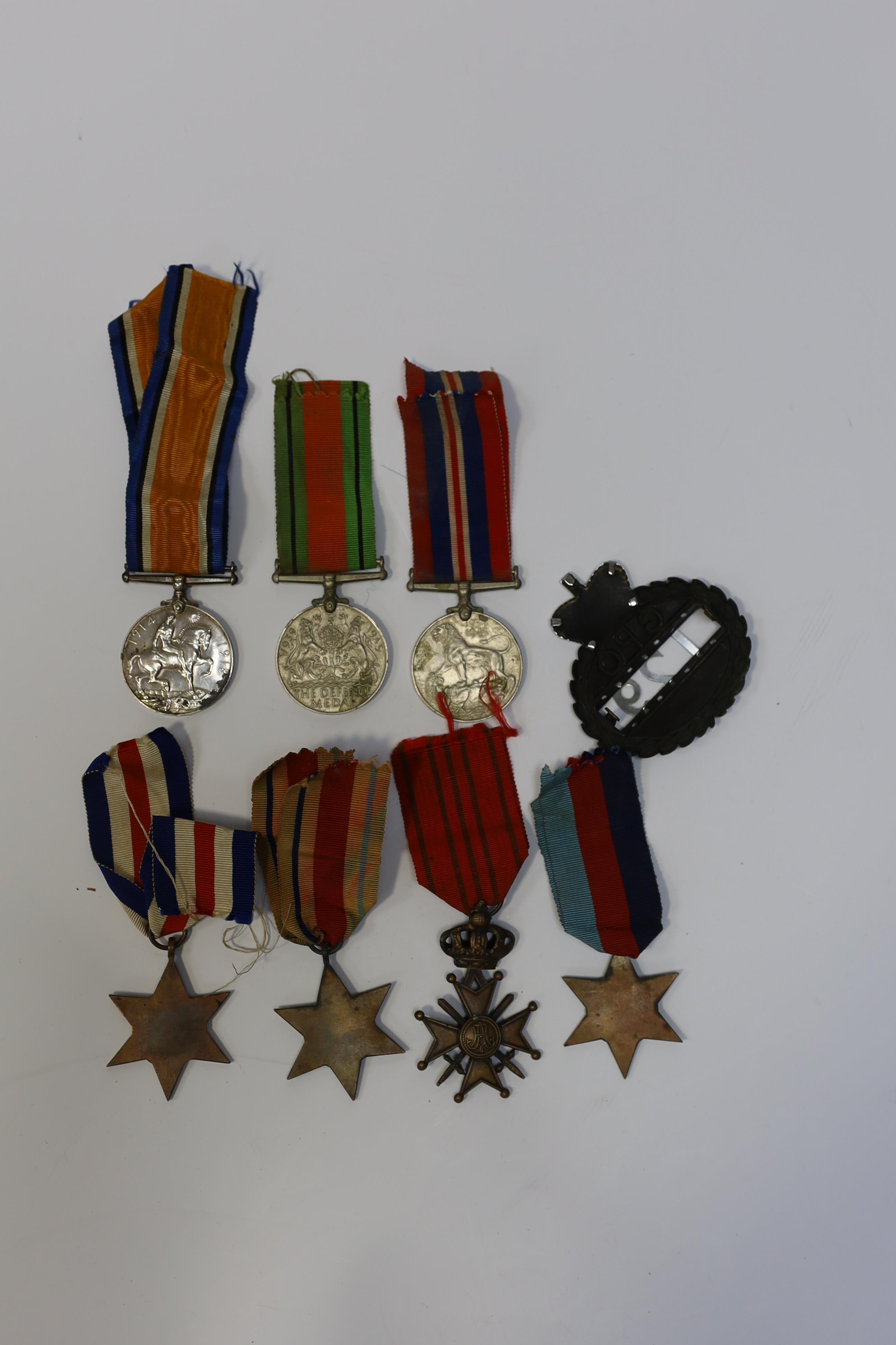 Seven medals including; a First World War British War Medal awarded to PTE. H. Lee DURH. L.I., A 1939-1945 medal, The Defence Medal, the Africa Star, the France and Germany Star, the 1939-1945 Star, plus a GPO cap badge.